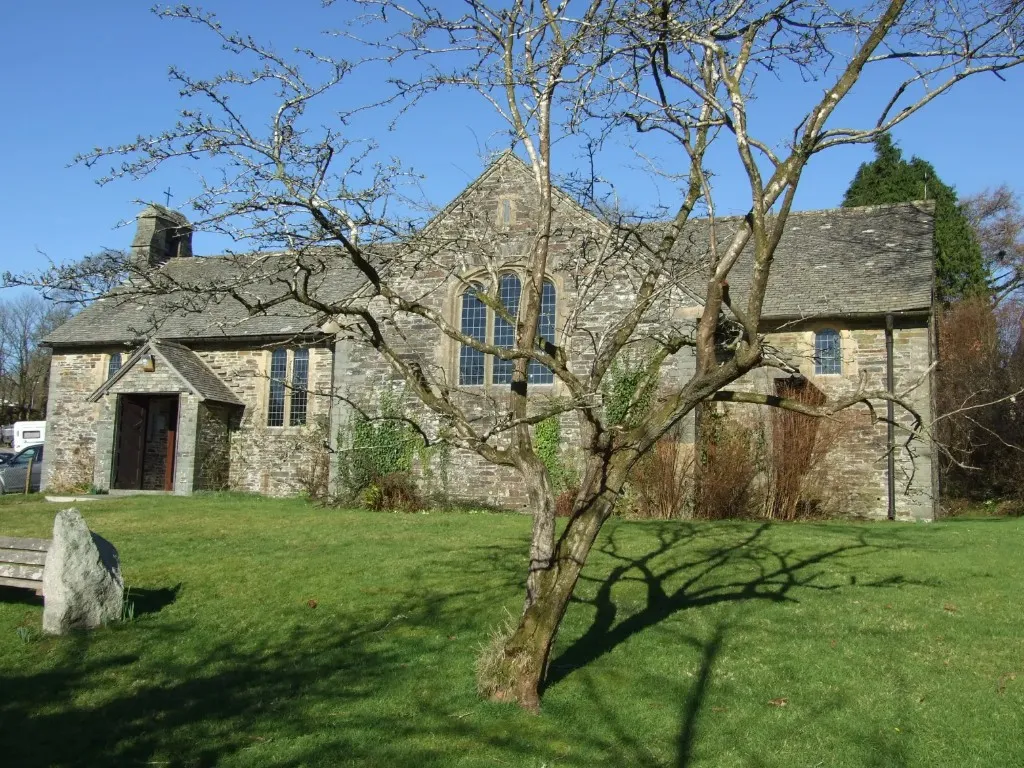 Historic stone church and churchyard on a sunny day
